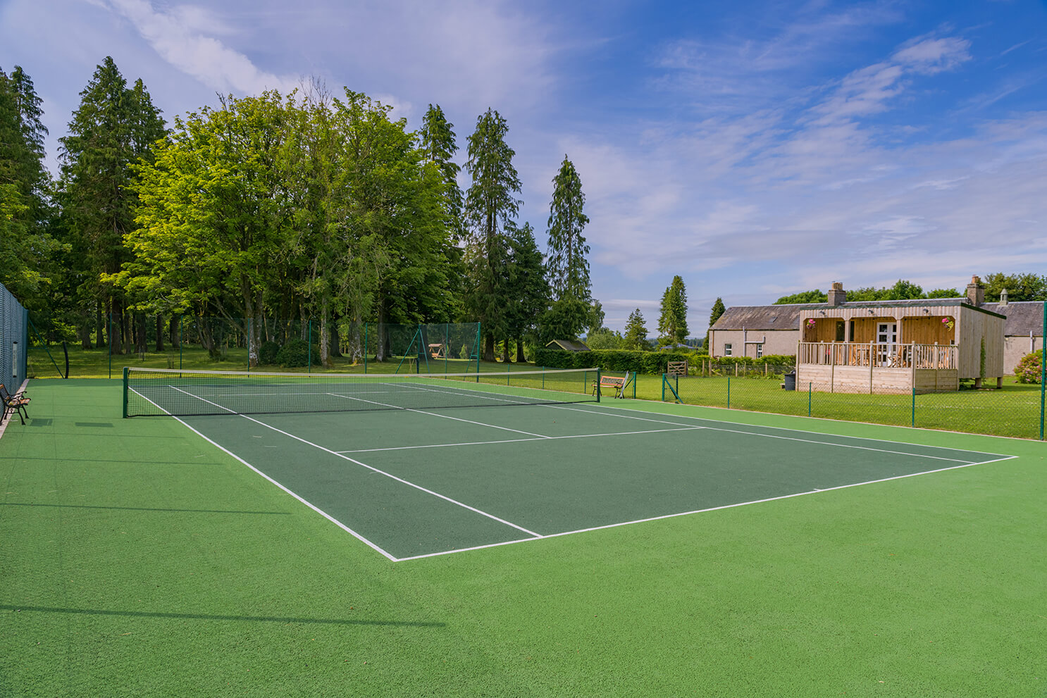 Shared use of the tennis court during your stay in our luxe holiday cottages | Logie Cottages